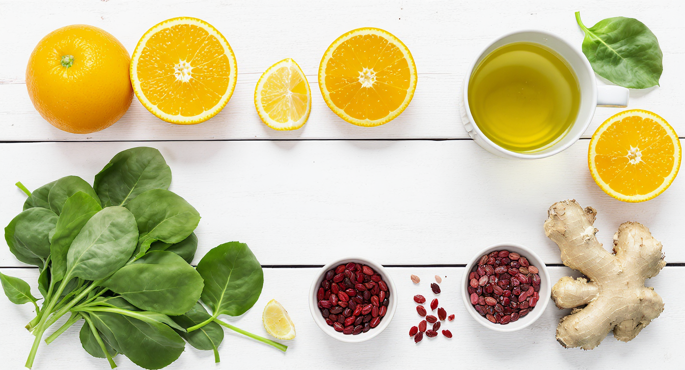A flat lay of immune-boosting foods like fruits and vegetables that can help prevent flat warts.